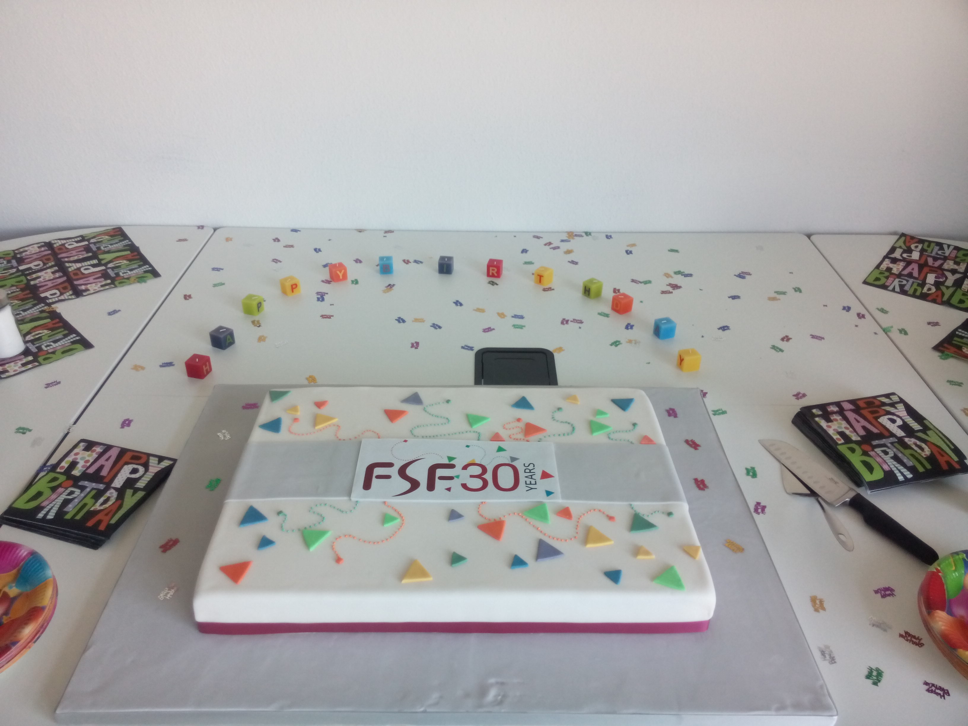 A cake with the FSF30 birthday logo on it